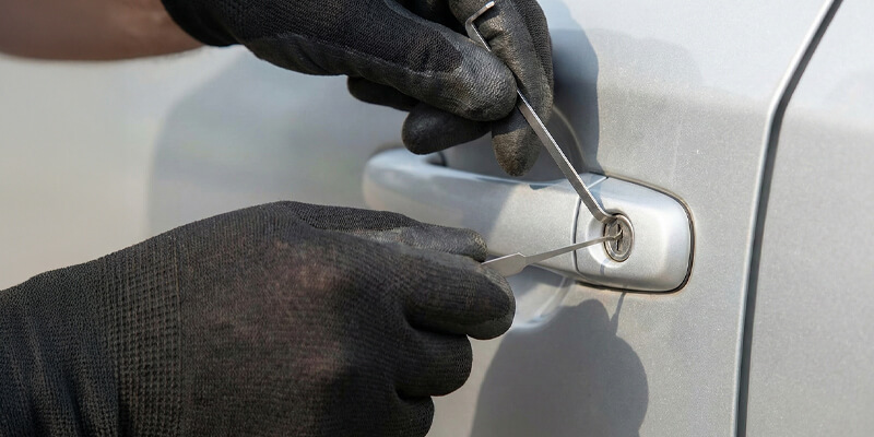 Person unlocking their car with a brand new car key